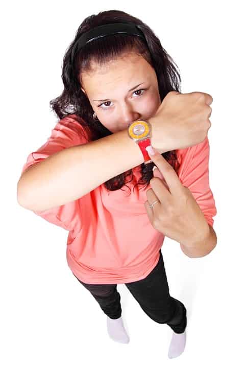 Sad woman showing her watch